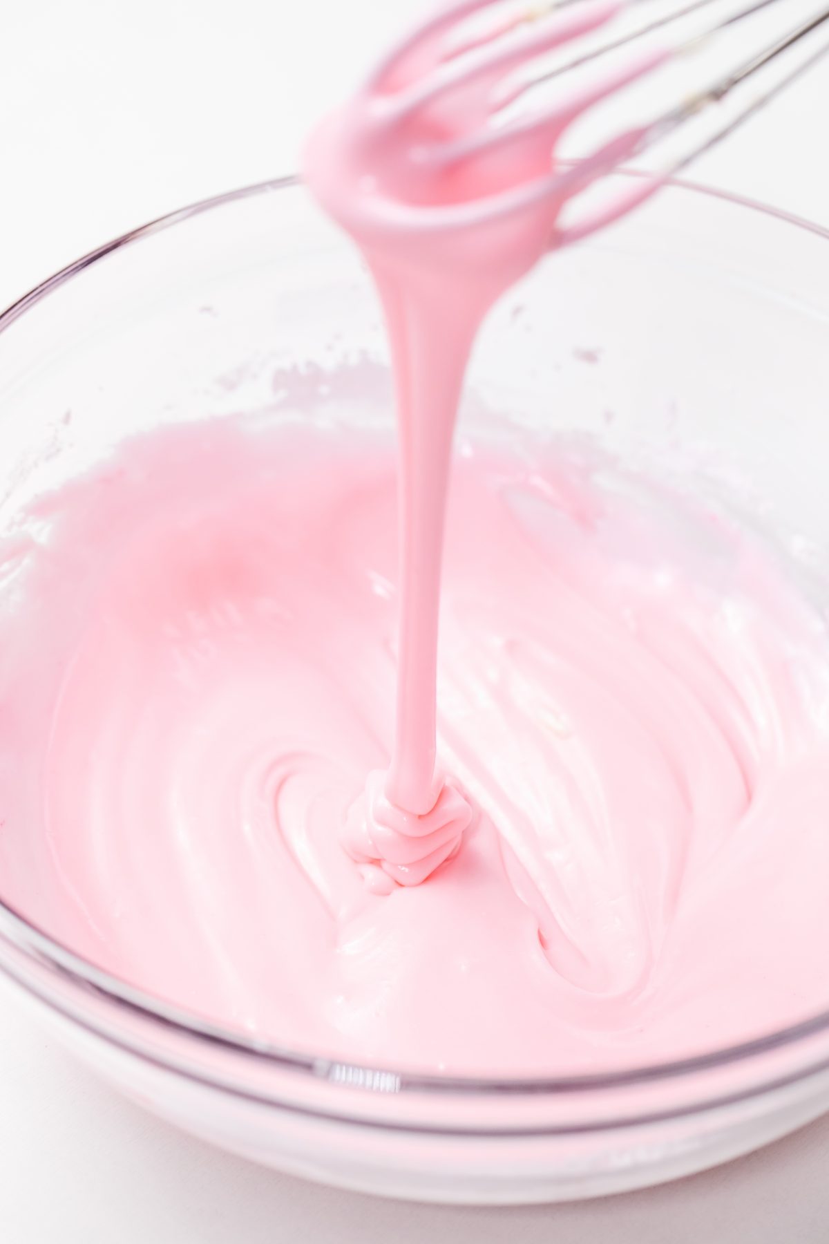 Stir in pink food coloring to frosting mixture