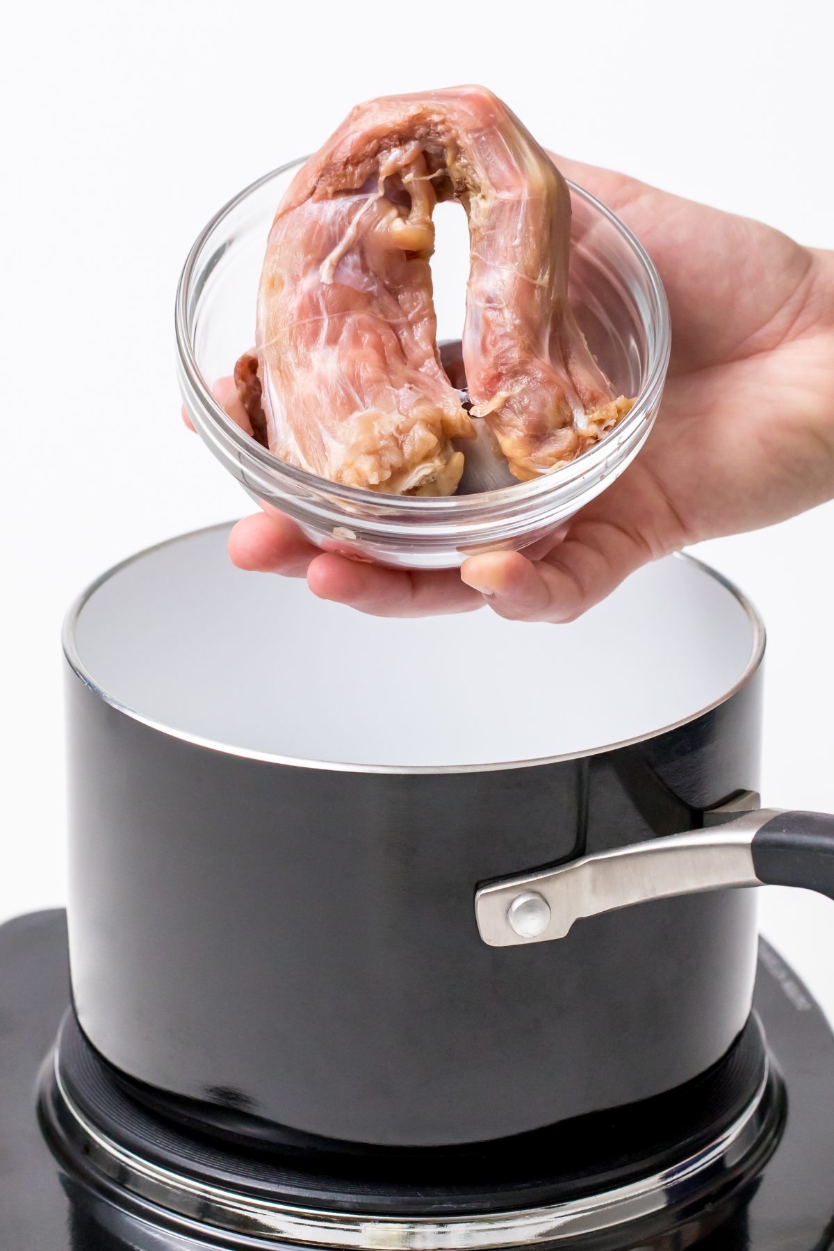 5D4B2362 - James Beard Roasted Turkey - placing turkey neck and giblets in a sauce pan