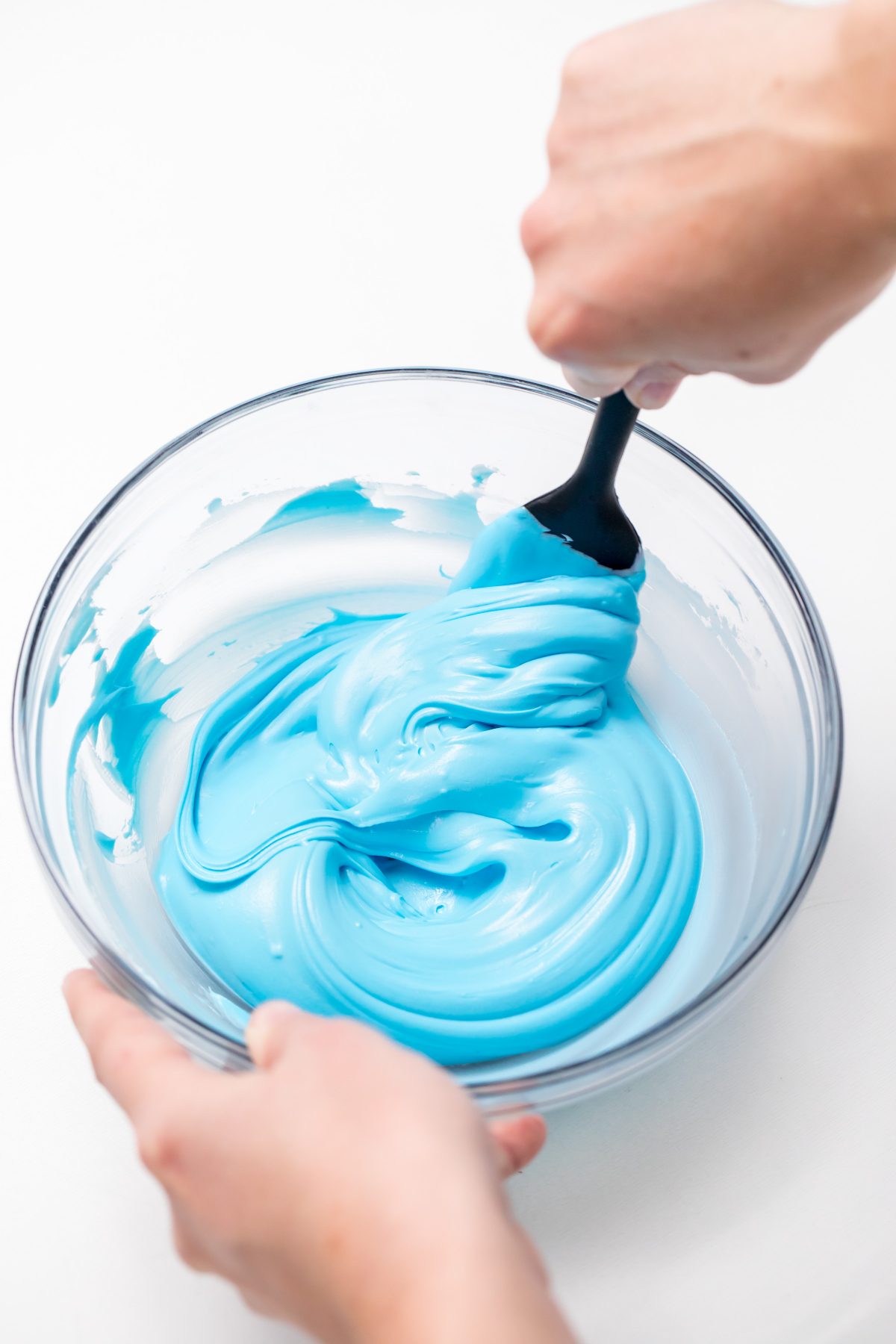 5D4B2953 - Unicorn Hot Chocolate - mixing blue food coloring with whipping cream in a mixing bowl
