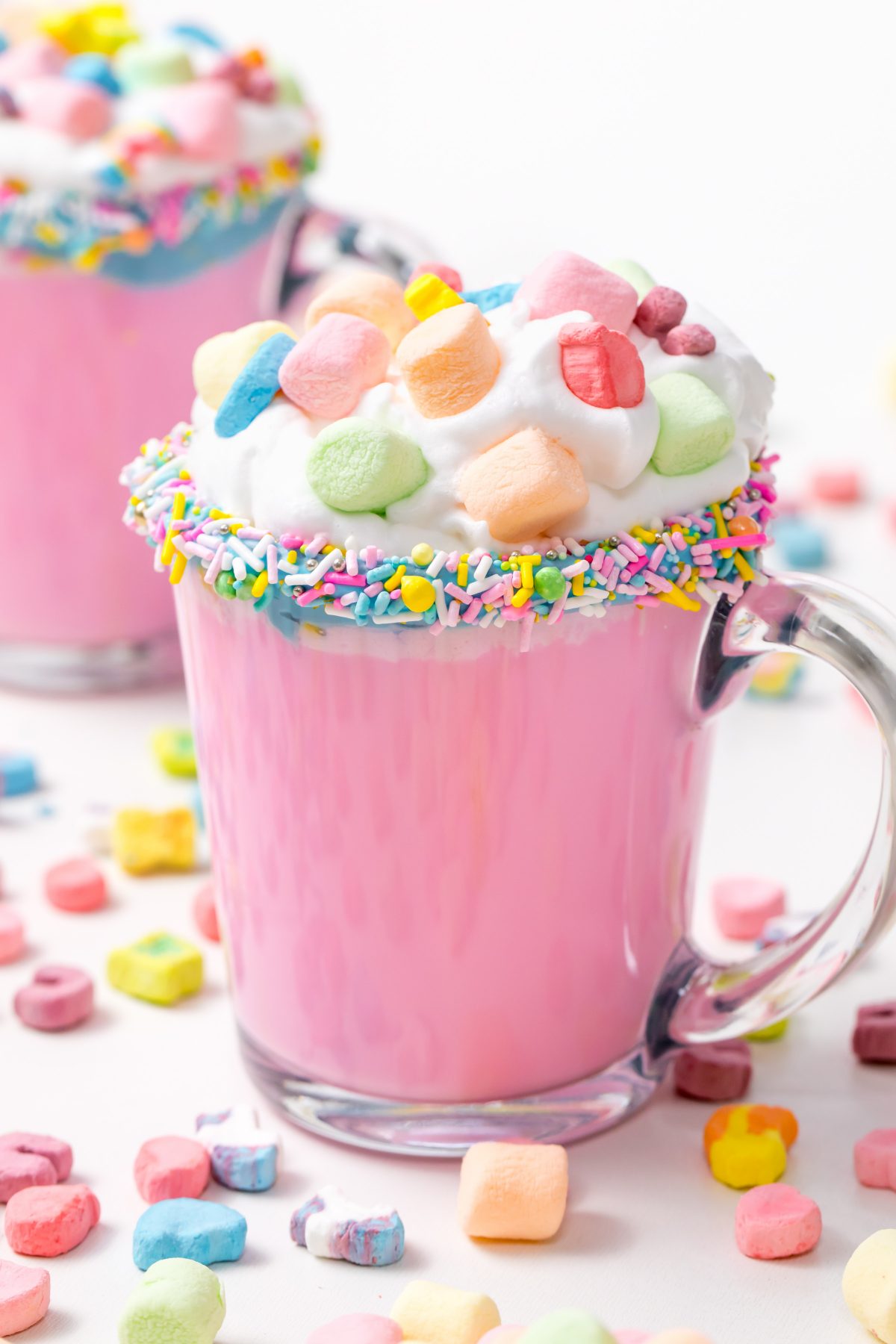 5D4B3142 - Unicorn Hot Chocolate - pink hot chocolate with whipping cream, lucky charms marshmellows on a white table