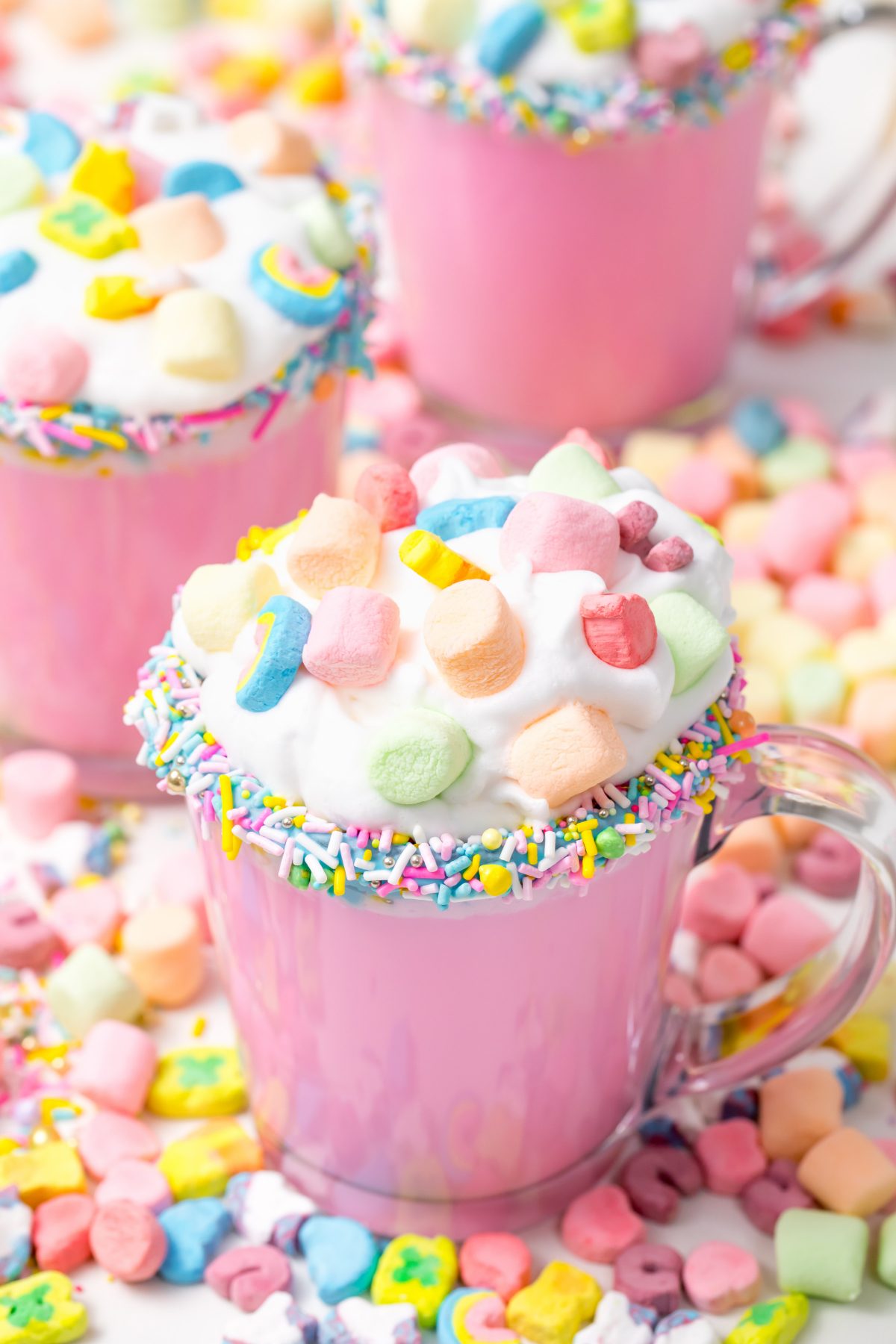 5D4B3163 - Unicorn Hot Chocolate - pink hot chocolate with whipping cream, lucky charms marshmellows on a white table