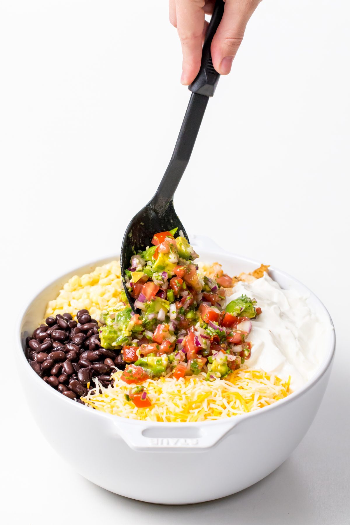 Colorful salsa goes on the top for Grilled chicken and quinoa burrito bowls with avocado salsa