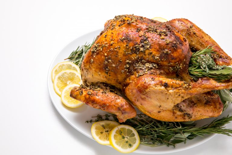 5D4B5461 - Easy No fuss Thanksgiving Turkey - turkey on a plate with lemon slices