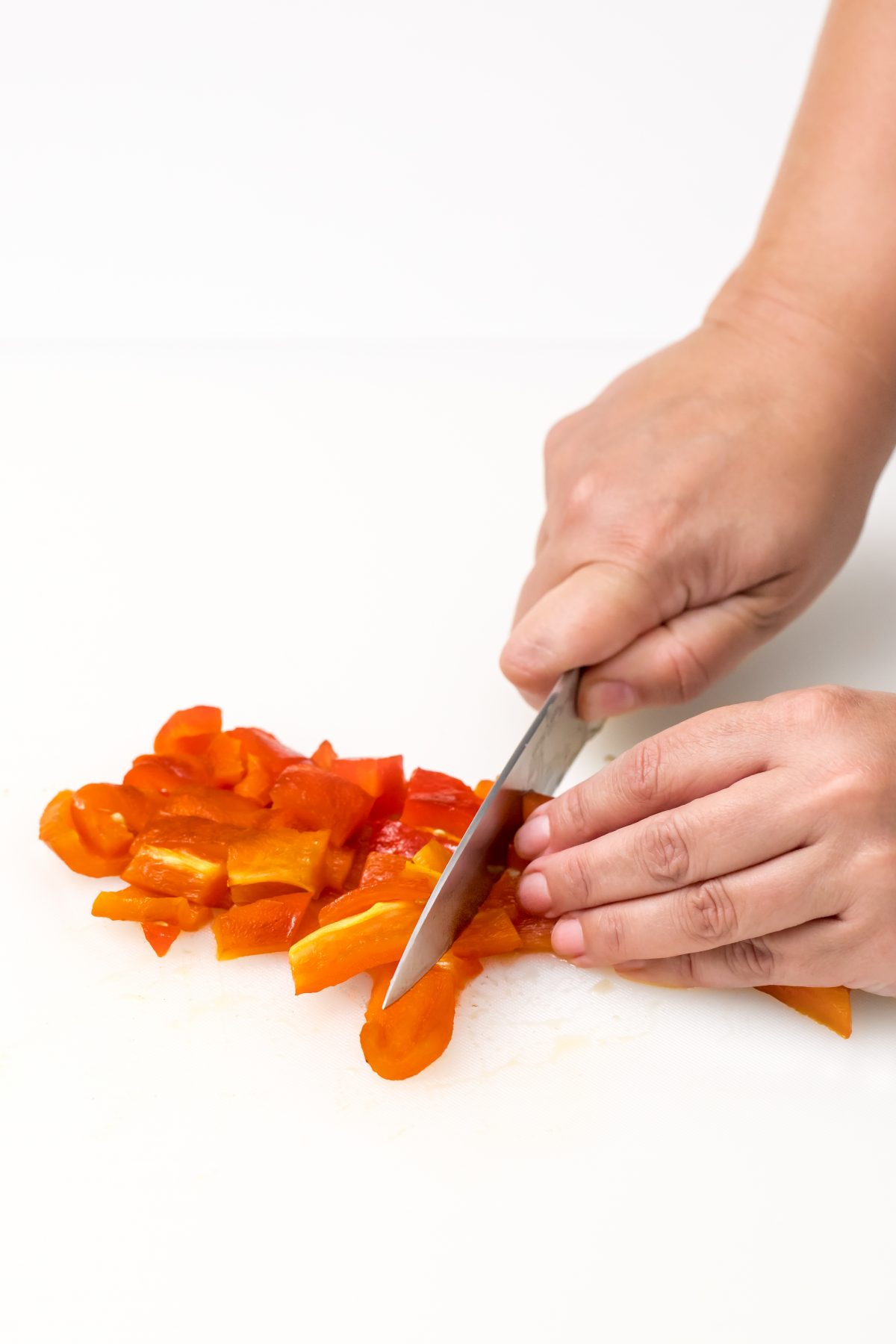 Clean and chop red peppers