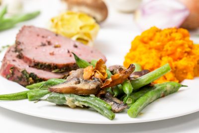 5D4B2900 - Vegan Green Bean Casserole - plated green beans with a side of ham and sweet potatoes
