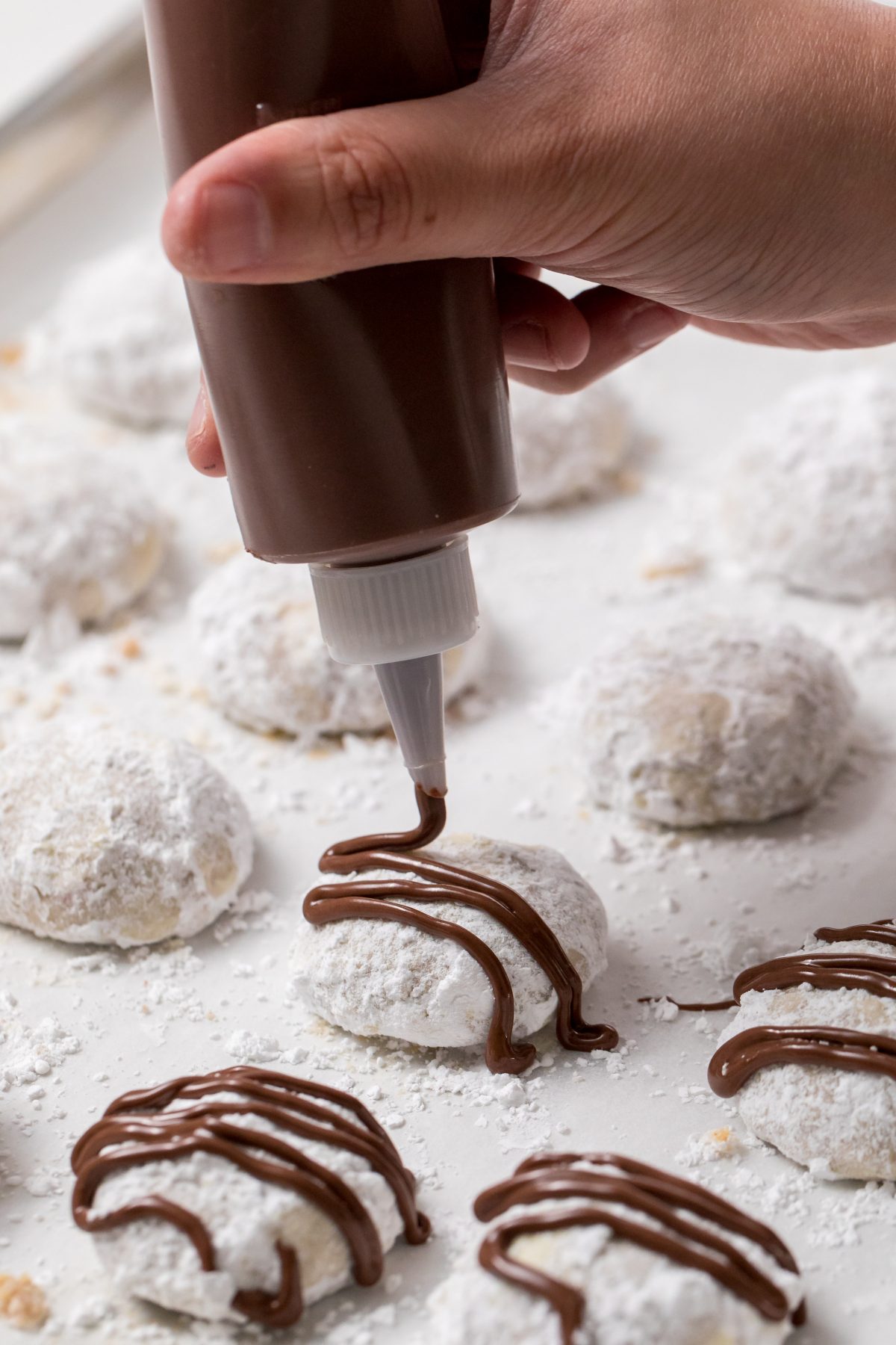5D4B5472 - Chocolate Covered Snowball Peppermint Cookies - Make the chocolate drizzle