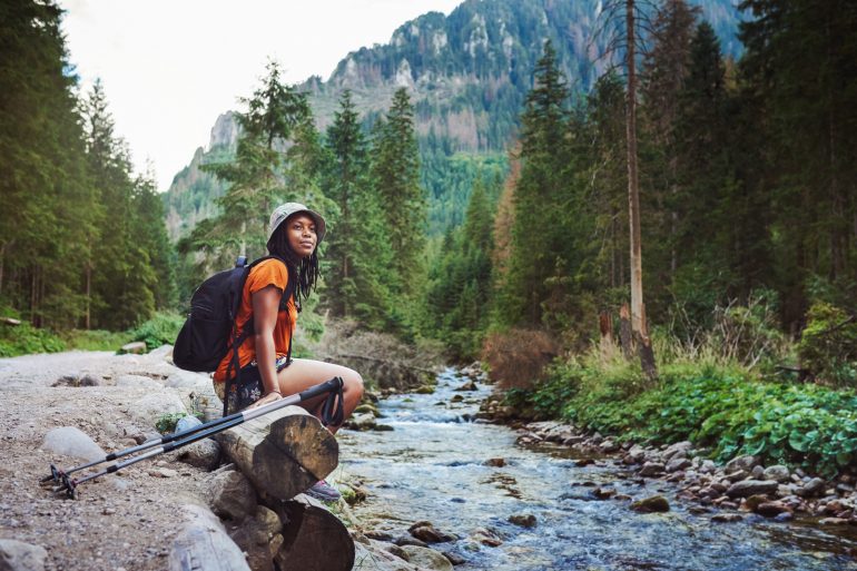 Ways to practice self-care in the New Year woman hiking