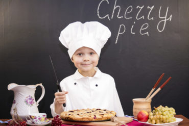 boy chef cooked cherry pie