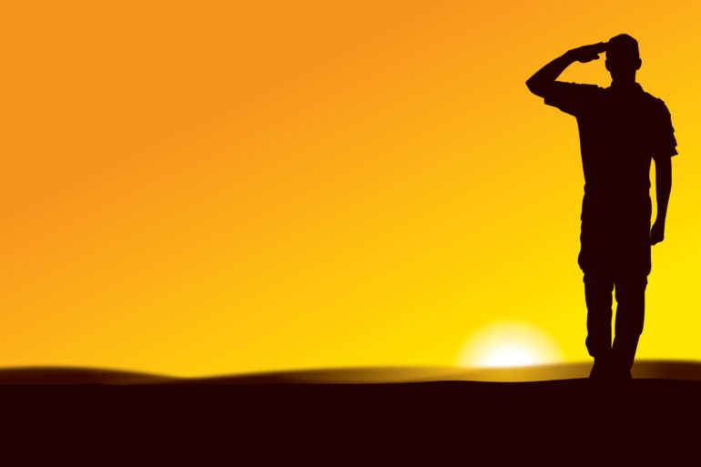US Army Soldier Saluting at Sun Rise or Sun Set