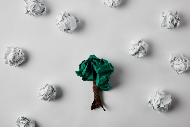 Ball of paper shaped into a tree on white background
