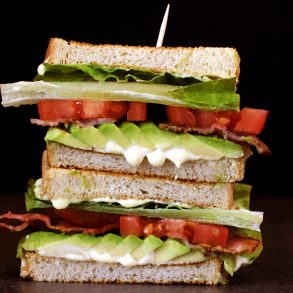 Stacked BLT sandwich with avocado