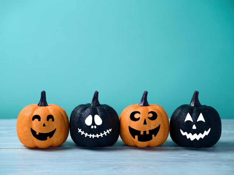 halloween party checklist pumpkins on teal background
