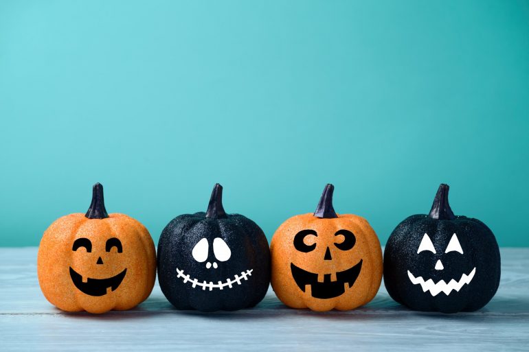 halloween party checklist pumpkins on teal background