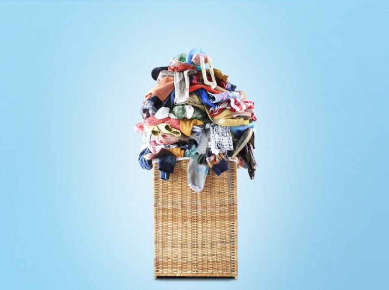 huge pile of clothes on blue background