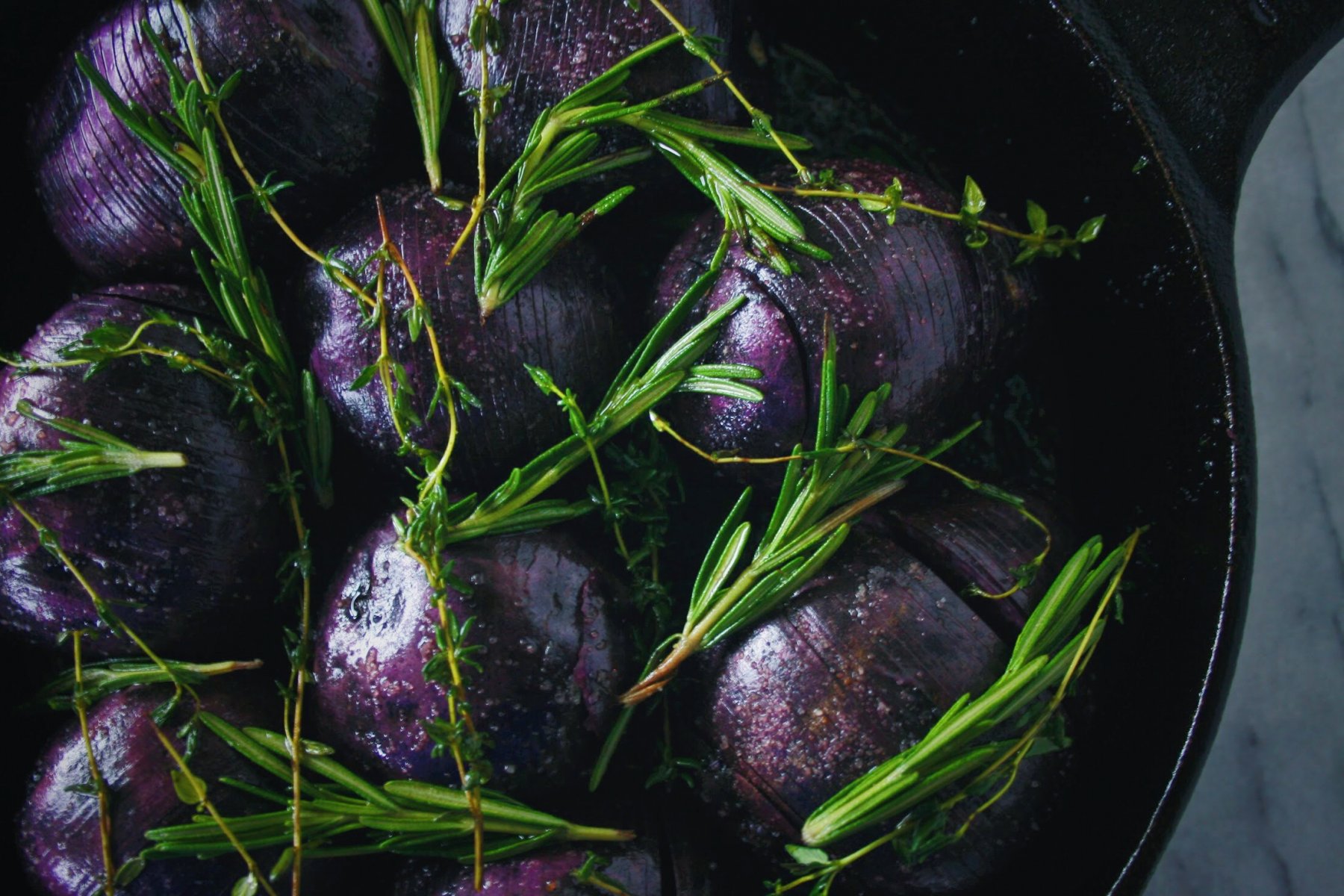 blue potatoes topped with fresh herbs