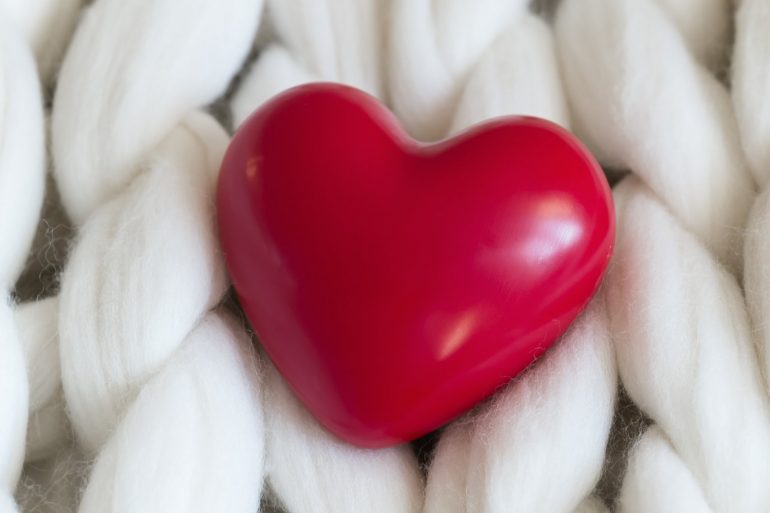 relationship questions heart on knitted background